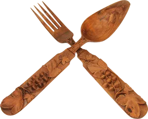 Carved Wooden Forkand Spoon Crossed PNG image