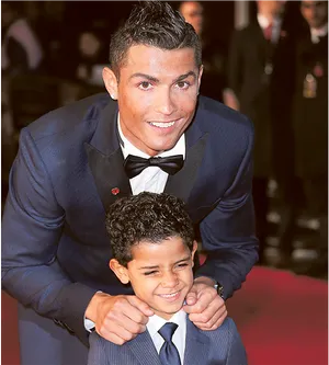 Cristiano Ronaldo Smiling With Child At Event PNG image
