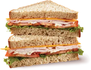 Delicious Turkey Sandwichon Wheat Bread PNG image