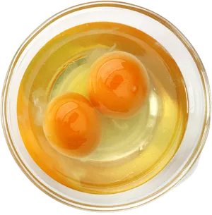 Double Yolk Eggsin Bowl PNG image