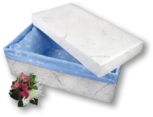 Eco Friendly Coffinwith Floral Tribute PNG image