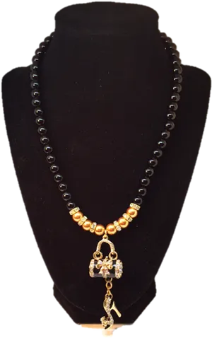 Elegant Black Beaded Necklacewith Golden Pendant PNG image