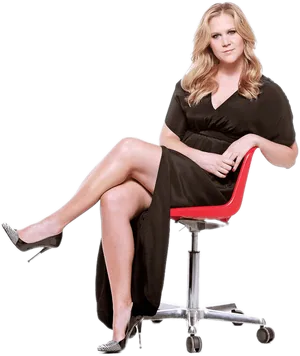 Elegant Woman Seatedin Red Office Chair PNG image