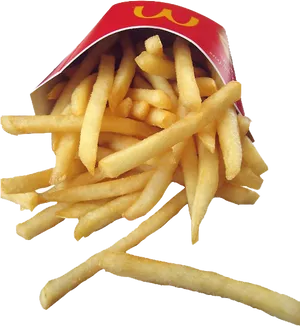 Golden French Fries Spilled From Red Carton PNG image