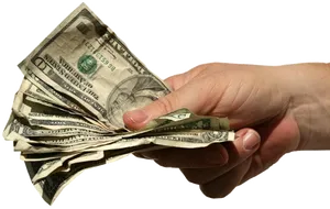 Hand Holding Crumpled Dollars PNG image