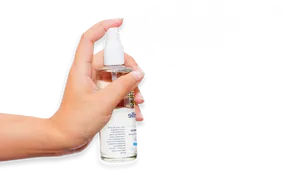 Hand Holding Spray Bottle Misting PNG image