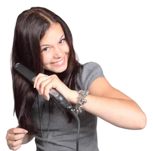 Happy Teen Girl Styling Hairwith Flat Iron