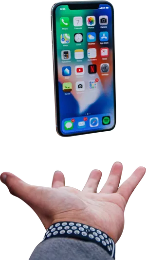 I Phone X Balancedon Hand PNG image