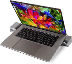 Mac Book Prowith Colorful Screenand Accessories PNG image
