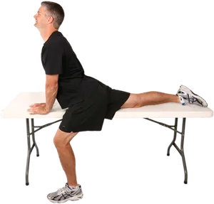 Man Performing Hip Flexor Stretchon Table PNG