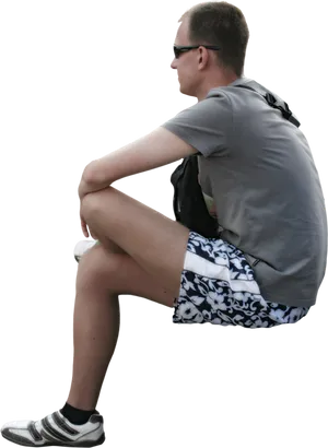 Man Sitting Casually Outdoors PNG image