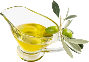 Olive Oilin Glass Gravy Boatwith Olive Branch PNG image