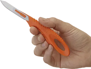 Orange Utility Knifein Hand PNG image