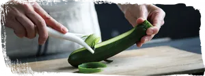 Peeling Zucchinion Cutting Board PNG