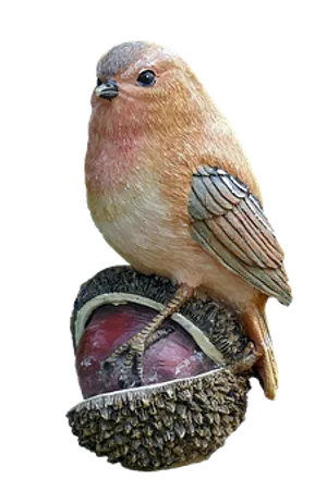 Perched Bird Sculptureon Acorn PNG image