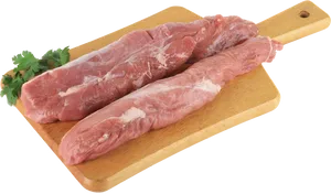 Raw Pork Tenderloinon Cutting Board PNG image