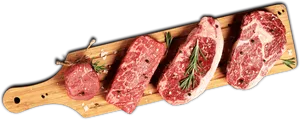 Raw Steak Selectionon Wooden Board PNG image