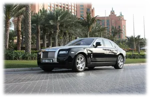 Rolls Royce Luxury Sedan Outside Hotel PNG image