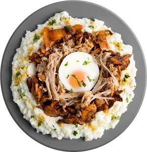 Savory Fried Egg Gritsand Pulled Pork Dish PNG image