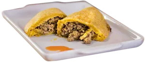 Savory Stuffed Pastry Halved PNG image