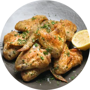 Seasoned Chicken Wingswith Lemon Garnish PNG image