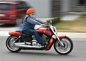 Sikh Man Riding Motorcycle PNG image