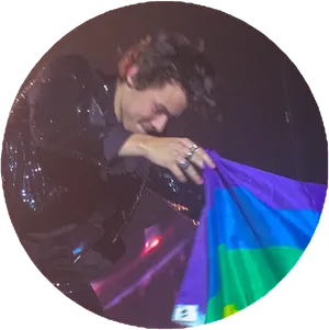 Singer Holding Pride Flag Concert Moment PNG image