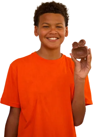 Smiling Boy Holding Chocolate Bunny PNG