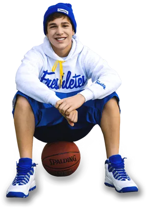 Smiling Teen Basketball Player Sitting PNG image