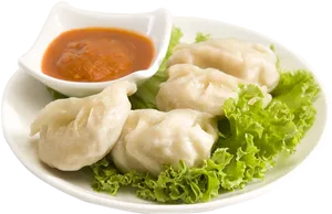 Steamed Momo Dumplingswith Sauce PNG image