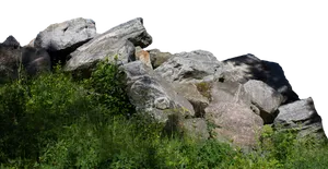 Sunlit Boulders Grassy Foreground PNG image