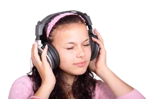 Teenage Girl Enjoying Music With Headphones