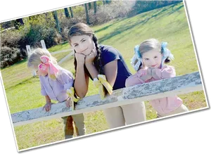 Three Girls Leaningon Fence Outdoors PNG image