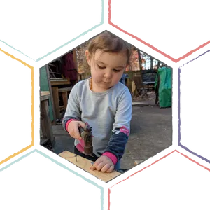 Toddler Using Hammer Outdoors PNG