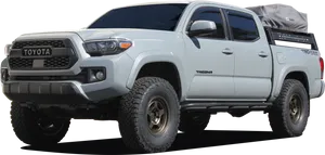 Toyota Tacoma Offroad Truckwith Rooftop Tent PNG image