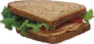 Turkey Lettuce Tomato Sandwichon Wheat Bread PNG image