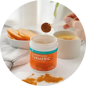 Turmeric Superfood Powder Scooping PNG image