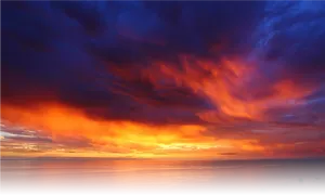 Vivid_ Sunset_ Over_ Ocean PNG image