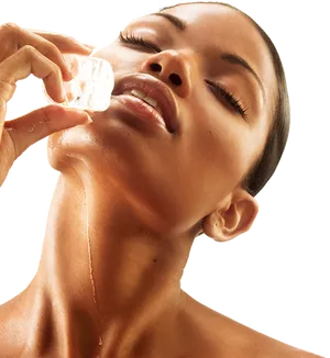 Woman_ Applying_ Facial_ Ice_ Treatment PNG image