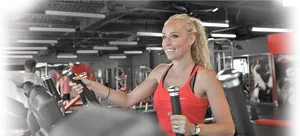 Woman Using Chest Press Machineat Gym PNG image