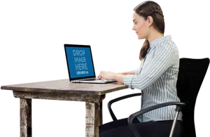 Woman Workingon Laptopat Desk