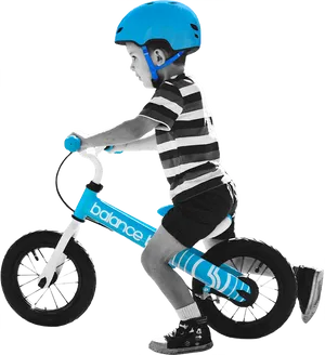 Young Boy Riding Balance Bike