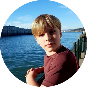 Young Boy Waterfront Vacation PNG image