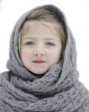 Young Girl Wrappedin Knit Scarf PNG image